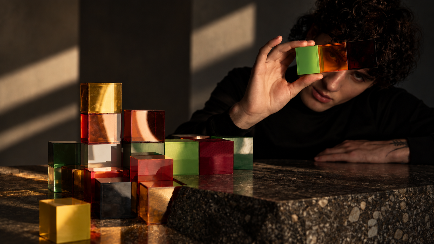 Artist looking through translucent sculptural color fields